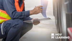 A person squatting down note taking next to a lorry.
